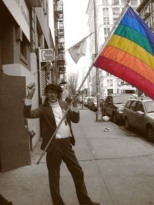 Sylvia Rivera holding a pride flag